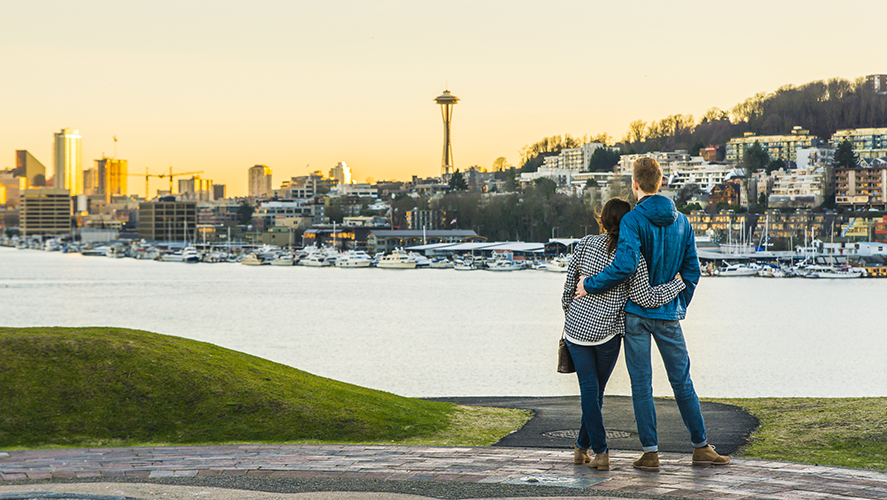 Dating | a couple hug and looking Seattle city landscape with sunset ,Seattle,Washington,USA.